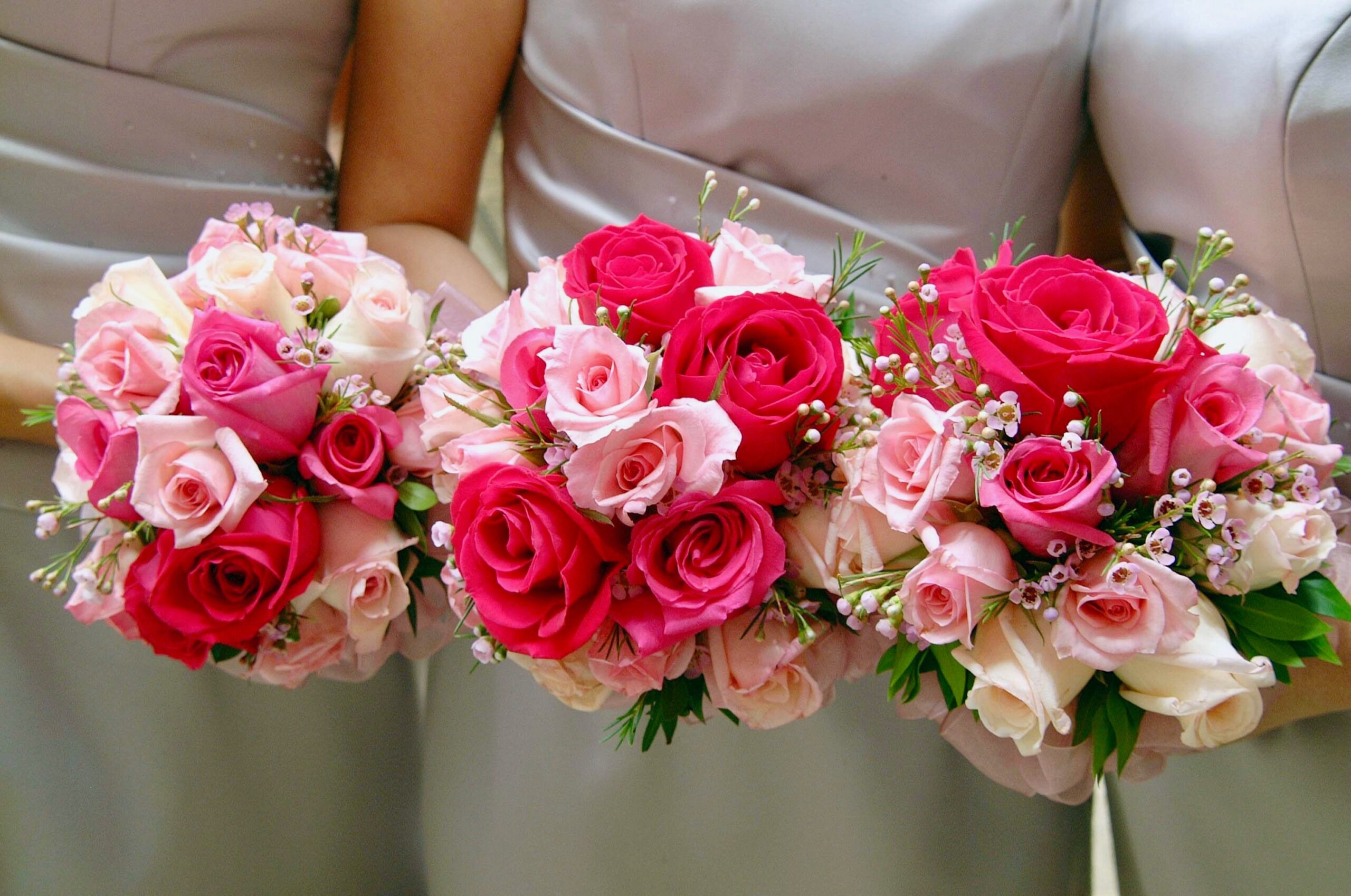 Home Beautiful bridal bouquets featuring pink and red roses, ideal for weddings and celebrations.